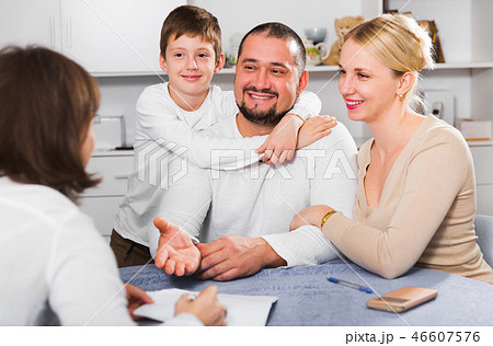Friendly family with female designer at home 46607576