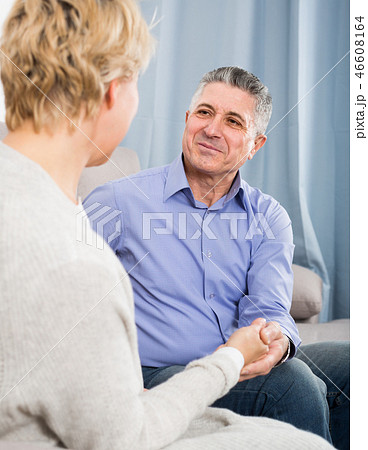 married couple in house are warmly reconciled after quarrel 46608164