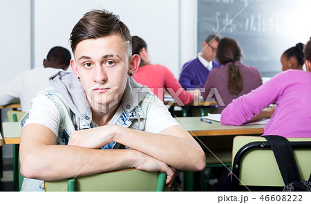 Alone outcasted student being mobbed by other students Alone outcasted student being mobbed by other students 46608222