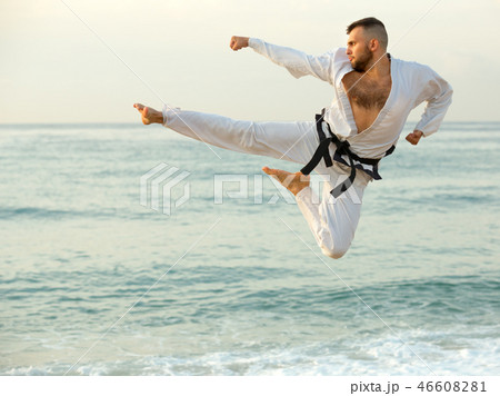 Male is training kick in jump Male is training kick in jump 46608281