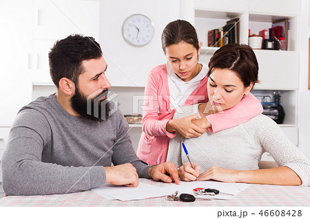Father and mother signing divorce papers 46608428