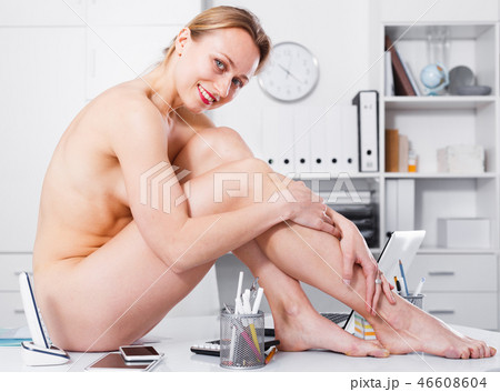 naked girl sitting on the table 46608604