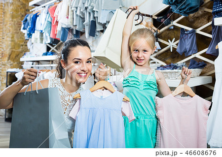 charming mother with daughter in shop charming mother with daughter in shop 46608676