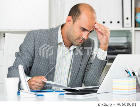 Male having lot of work and problems Male having lot of work and problems 46608681