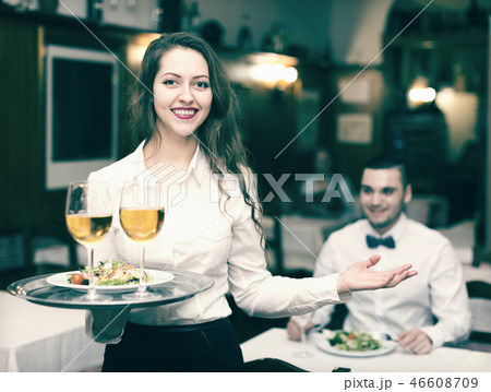 Waitress with beverages 46608709
