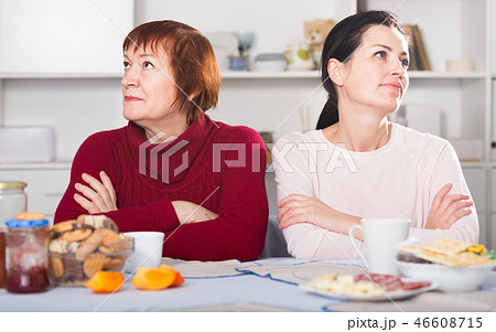 Portrait of sad mature woman talking with daughter 46608715