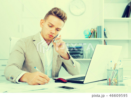 Business partner with smart phone and laptop Business partner with smart phone and laptop 46609595