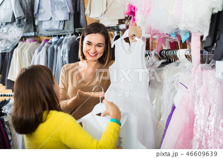 Mother and daughter choosing pretty dress Mother and daughter choosing pretty dress 46609639