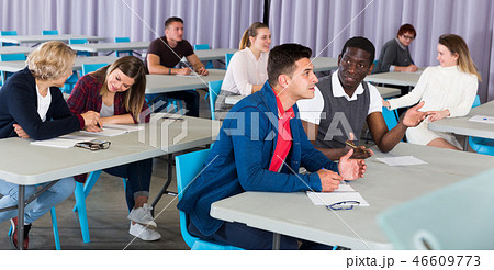 Adult students discussing lesson 46609773