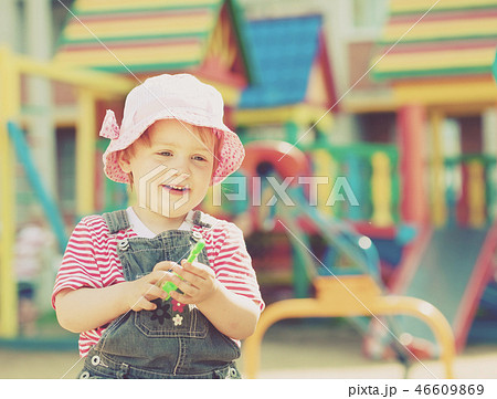 two-year child at playground two-year child at playground 46609869
