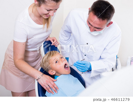 Woman with son are visiting dentist Woman with son are visiting dentist 46611279
