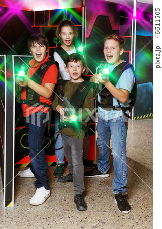 teen kids with laser guns during lasertag game 46611505