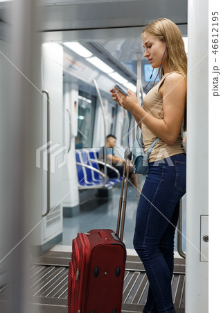 Woman with headphones in subway Woman with headphones in subway 46612195