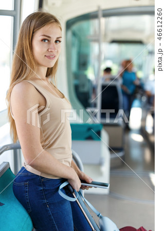 Woman traveling by subway train Woman traveling by subway train 46612260