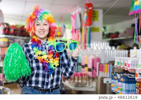 Girl in store of festival accessories Girl in store of festival accessories 46612619