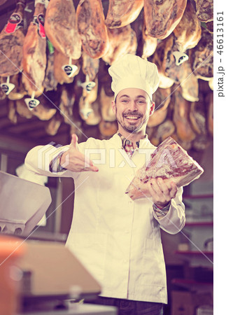 Seller offering piece of meat Seller offering piece of meat 46613161