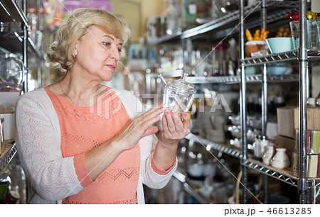 customer woman choosing crystal glass for wine customer woman choosing crystal glass for wine 46613285