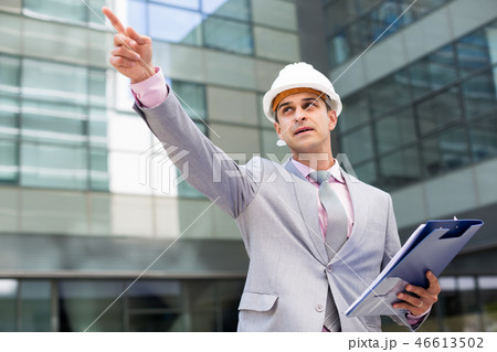 Businessman pointing at something 46613502