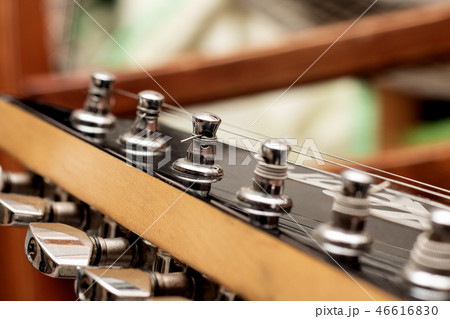 Wooden fingerboard of the guitar close-up Wooden fingerboard of the guitar close-up 46616830