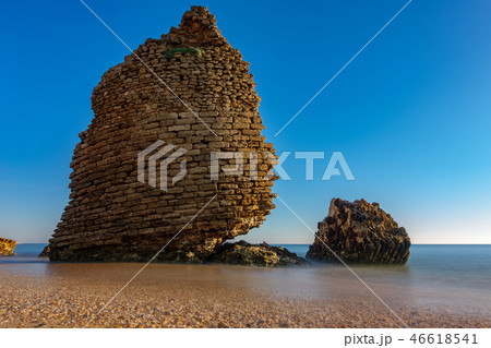 Old ruined defense tower near ocean, long exposure 46618541