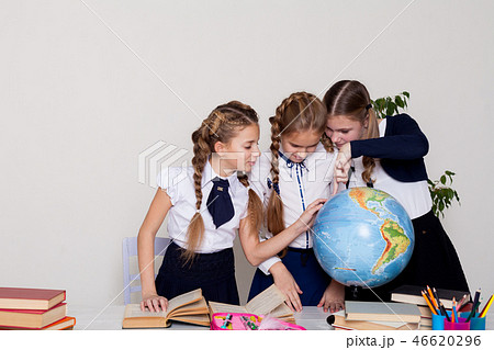 three schoolgirls girls learn world geography lesson on the map three schoolgirls girls learn world geography lesson on the map 46620296