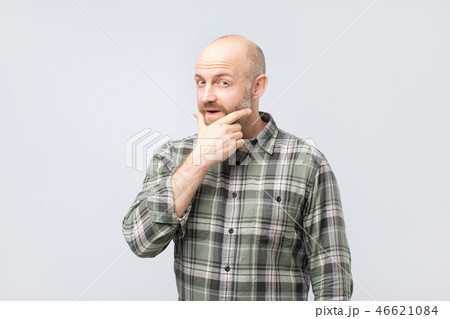 Middle aged man thinking, expressing leadership reflections and concerns, trying to make a decision. 46621084