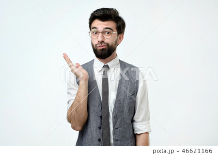Doubtful bearded young spanish man looking with mistrust. Doubtful bearded young spanish man looking with mistrust. 46621166
