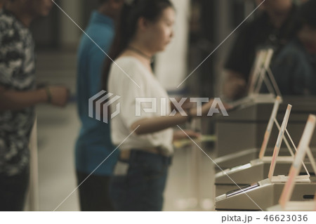 Tourist at pedestrian access control flap barriers 46623036