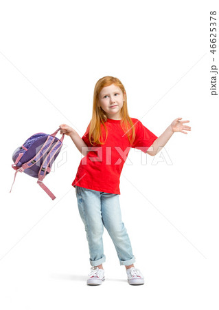 Full length portrait of cute little kid in stylish jeans clothes looking at camera and smiling 46625378
