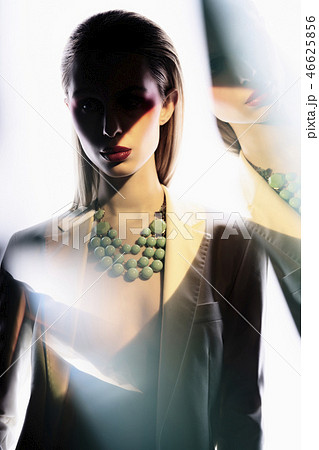 Sexy lady in colorful neacklace and white jacket 46625856