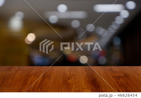 wooden table over blur restaurant, shopping mall wooden table over blur restaurant, shopping mall 46626454