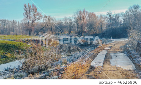 winter rural landscape, trees, rough country road. winter rural landscape, trees, rough country road. 46626906