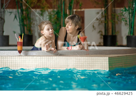Relaxing in swimming-pool Relaxing in swimming-pool 46629425