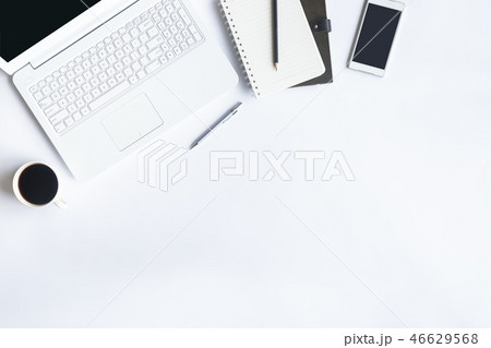 White desk office with laptop, smartphone and othe White desk office with laptop, smartphone and othe 46629568