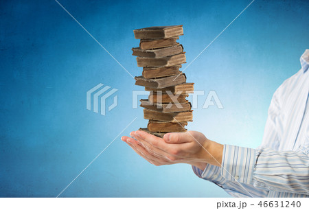 Stack of books in palms 46631240