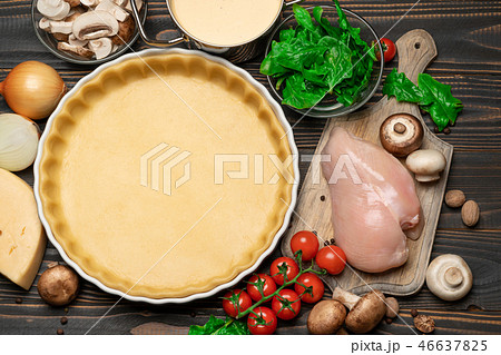 shortbread dough for baking quiche tart and ingredients in baking form shortbread dough for baking quiche tart and ingredients in baking form 46637825