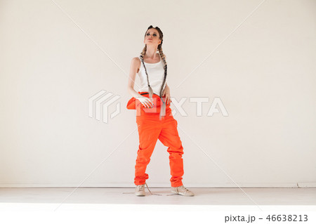 beautiful fashionable woman with braids dancing work overalls beautiful fashionable woman with braids dancing work overalls 46638213