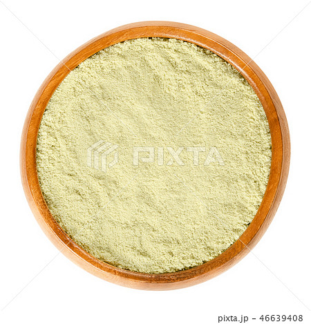 Wasabi powder in wooden bowl over white 46639408