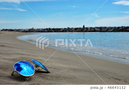 The Sun Glasses and Coconut on the Sea beach The Sun Glasses and Coconut on the Sea beach 46643132