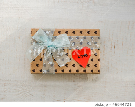 Box with a gift, tied with a ribbon Box with a gift, tied with a ribbon 46644721