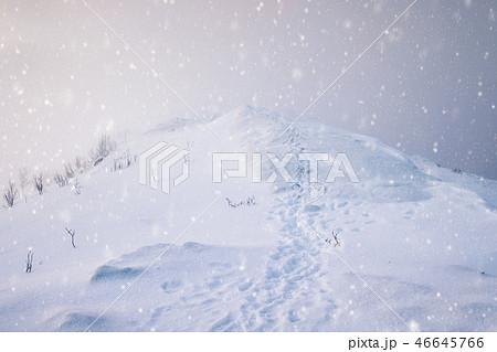 Snowy mountain peak with footprints 46645766
