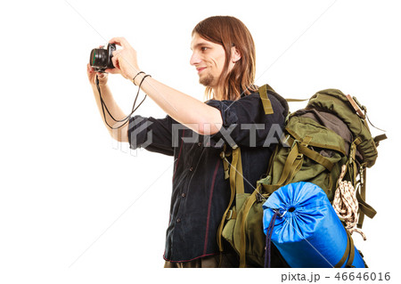 Man tourist backpacker taking photo with camera. 46646016