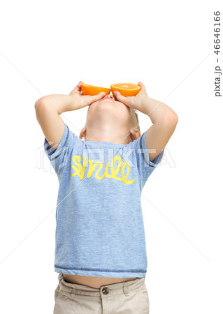 Full length portrait of cute little kid in stylish clothes with orange Full length portrait of cute little kid in stylish clothes with orange 46646166