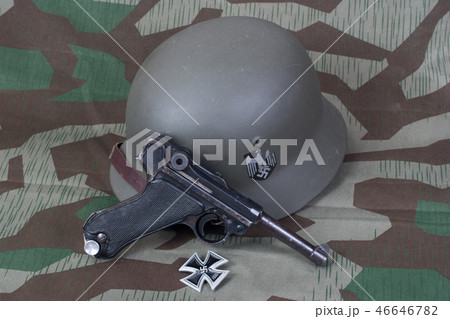 handgun, helm and medal Iron Cross  46646782