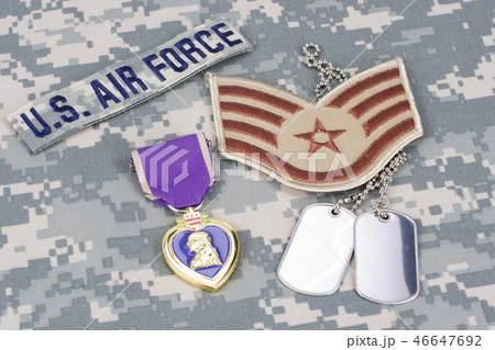 Purple Heart award on camouflage uniform 46647692