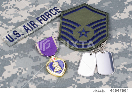 Purple Heart award on camouflage uniform 46647694