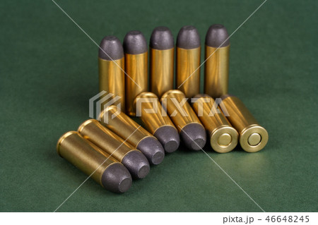Western-style revolver cartridges on green  46648245