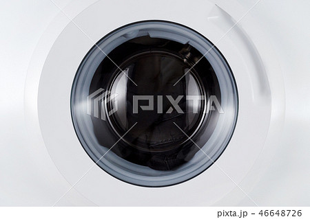 washing black clothes, closed wash machine closeup washing black clothes, closed wash machine closeup 46648726