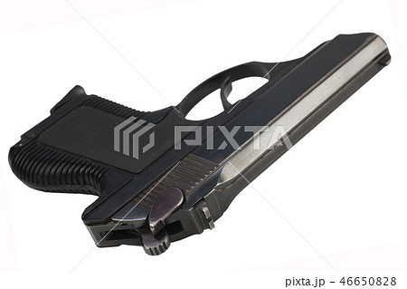 handgun with ammunition on the wooden table 46650828