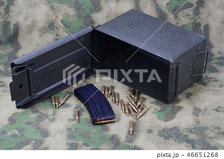 Ammo Can with ammo on camoflage background 46651268